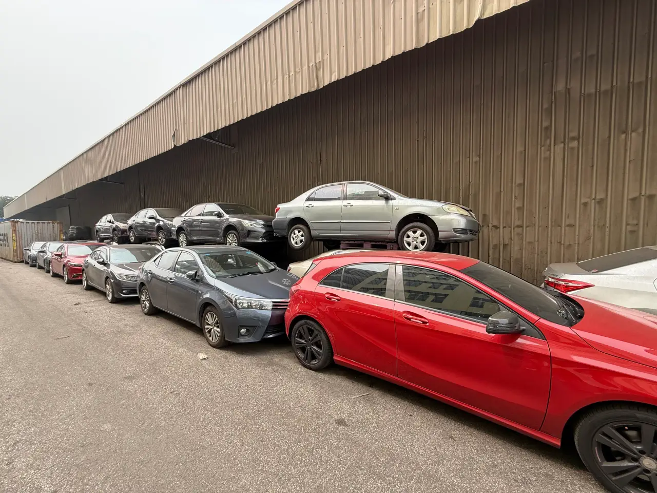 Vehicles lined up outside the Everise Auto warehouse